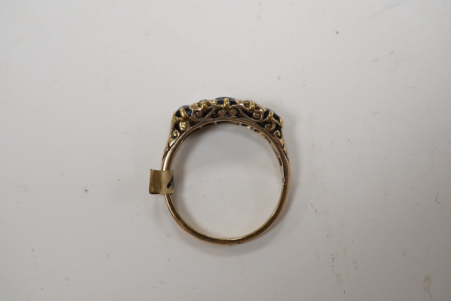 A yellow metal and three stone sapphire and four stone diamond set half hoop ring, size P/Q, gross weight 3.3 grams. Condition - poor to fair